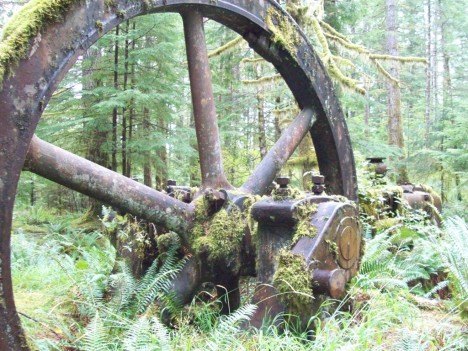 Today the great flywheel and other parts of the huge steam engine which powered the Lucky Jim Mine over 100 years ago stand silent and moss-covered for all to enjoy.